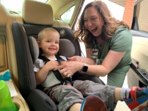 Car seat check with young boy