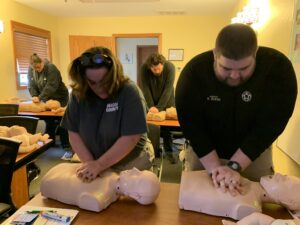 Man and woman perform CPR